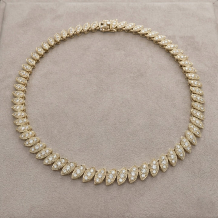 Captivating Leaf Necklace for female featuring gold plating with sparkling leaf-shaped segments forming an elegant jewelry necklace.