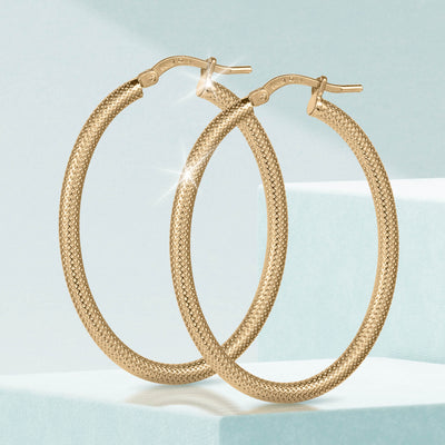 Lucente Hoop Oval Earrings in textured gold-tone metal with an elegant oval shape, perfect for adding a sophisticated touch to any jewelry collection.
