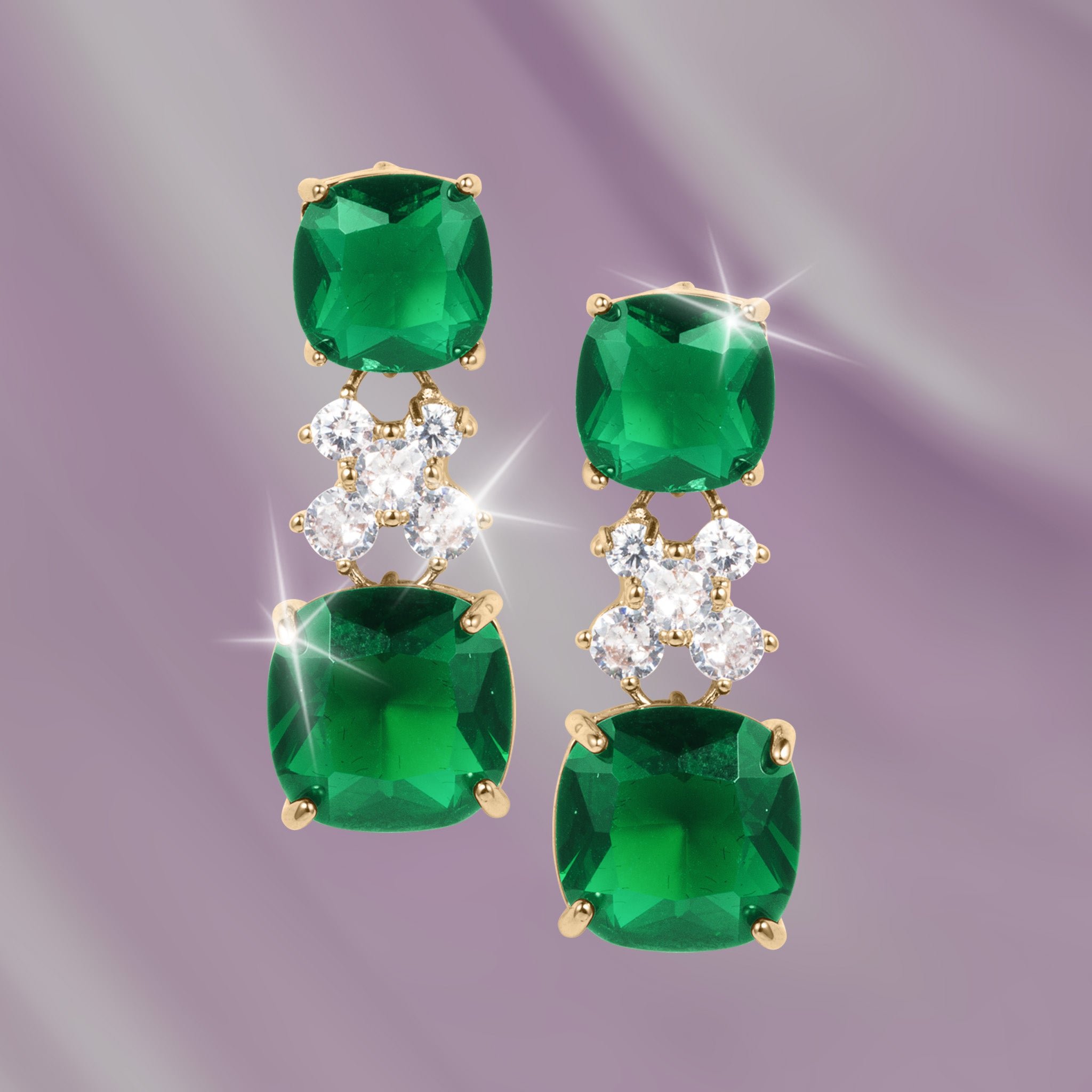 Freya Earrings featuring cascading emerald green gemstones and sparkling clear stones in a glamorous gold tone design Up To 75% Off Retail