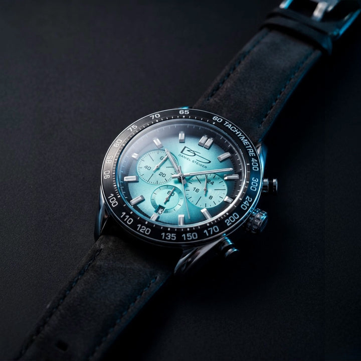 Hydrasteel Chrono Men's Watch with turquoise chronograph dial black leather strap and tachymeter bezel on a dark background Up To 75% Off Retail