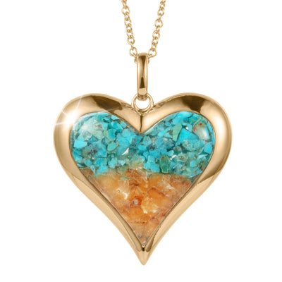 Sunlit Shore Heart Pendant featuring a gold-tone heart-shaped design with a vibrant inlay of turquoise and sandy-colored stones on a delicate chain necklace.