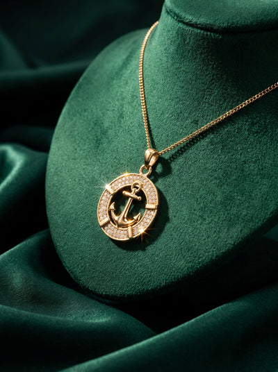 Mariner Pendant with a gold anchor design and sparkling accents on a delicate chain displayed against rich green velvet Up To 75% Off Retail