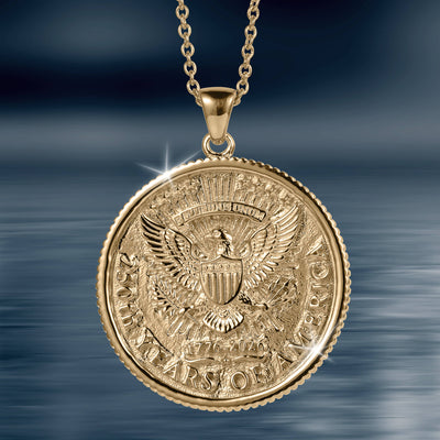 American Glory Pendant featuring a detailed gold eagle emblem with shield and patriotic inscriptions, hanging from a polished gold chain necklace.