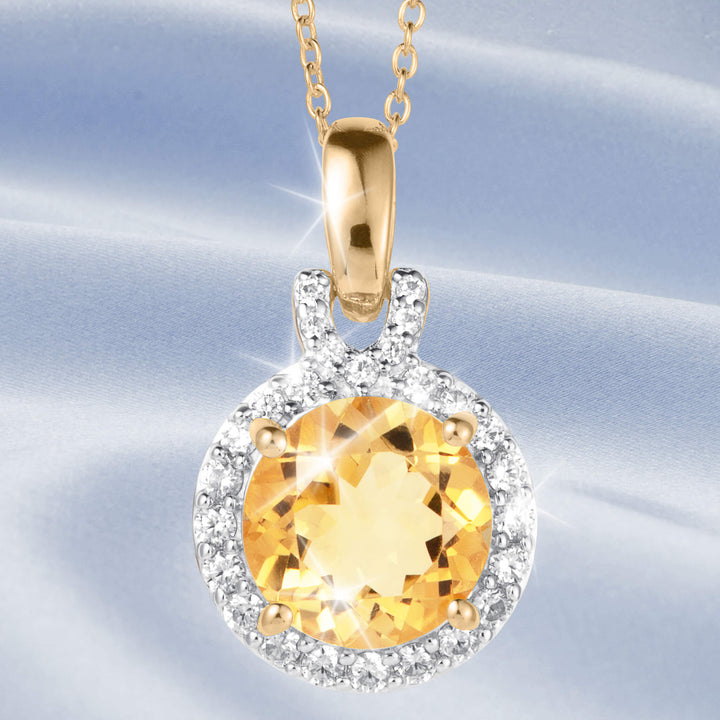 Golden Glow Collection gold pendant necklace with a round golden gemstone surrounded by sparkling clear stones on a delicate chain Up To 75% Off Retail
