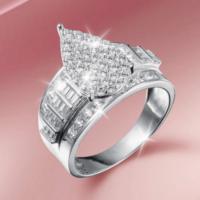 Lustrefall Ring featuring a pear-shaped cluster of sparkling diamonds set in polished silver with additional baguette and round cut stones accentuating the wide band design.