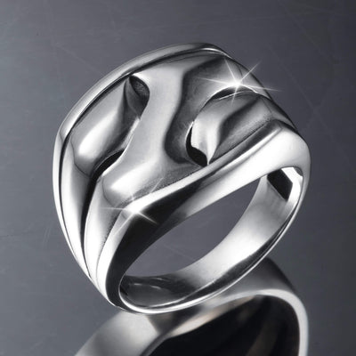 Polished silver designer ring featuring an interlocking pattern with smooth curves and a reflective finish, showcasing the Axis Interlock Men’s Ring.