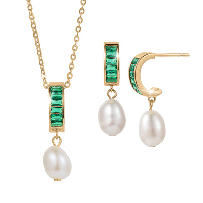 Elegant gold necklace and matching earrings from the Pearl Radiance Collection featuring green gemstones and hanging white pearls, designed for sophisticated jewelry lovers.