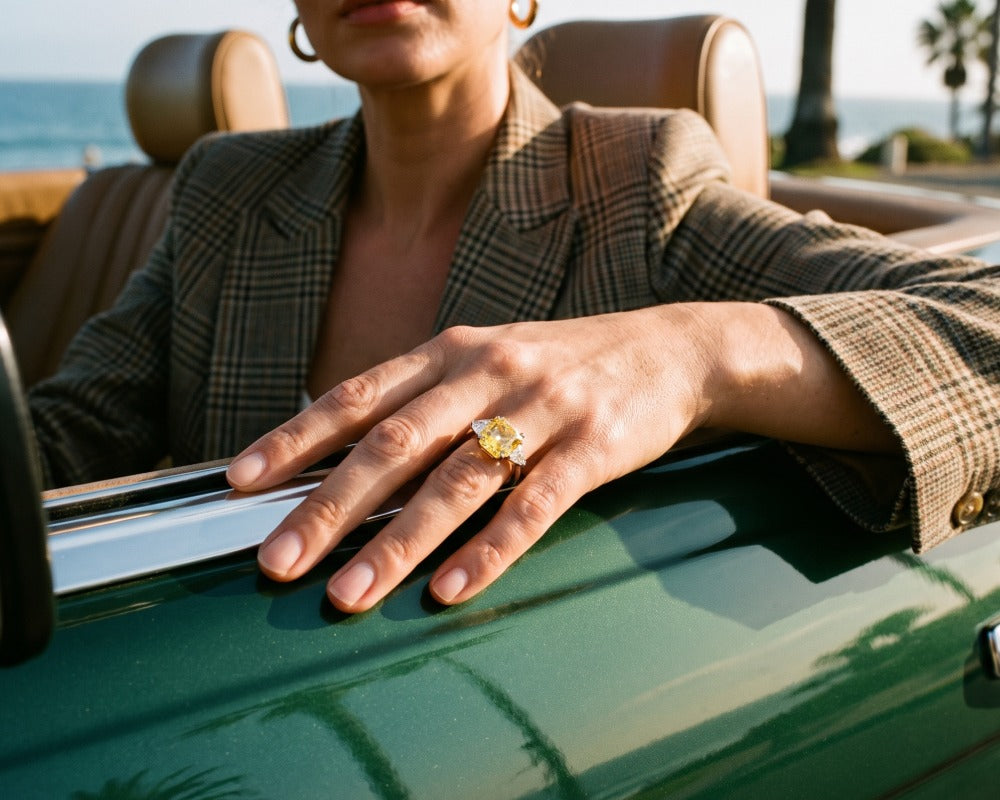 Sunlit Splendour Yellow Ring featuring a bright yellow gemstone worn on a hand resting on a vintage green car by the seaside Up To 75% Off Retail