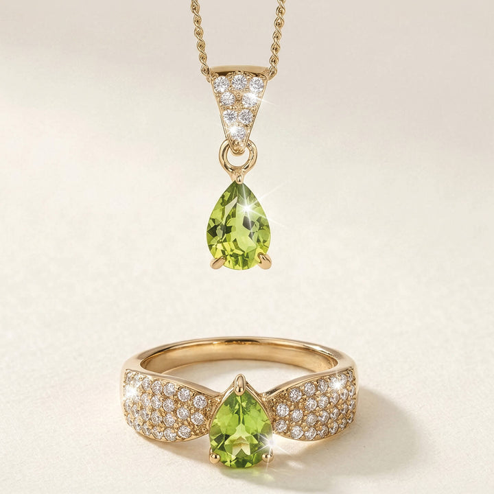 Elegant gold necklace and ring set from the Willow Grove Peridot Collection featuring pear-shaped peridot gemstones and sparkling pavé diamonds.