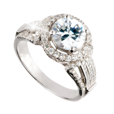 Regency Ring crafted in sterling silver featuring a large central round gemstone surrounded by smaller brilliant stones in an elegant, feminine design.