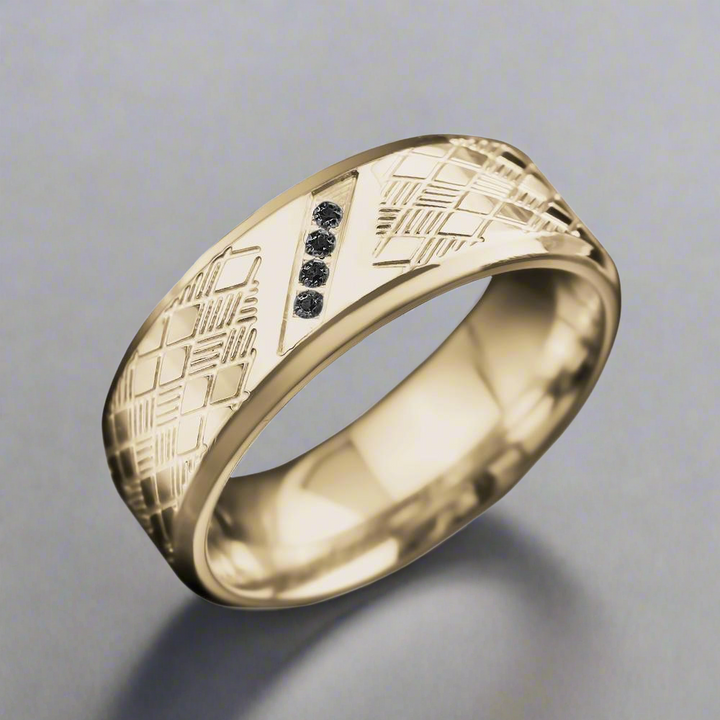Rafferty Steel Ring made of gold-plated stainless steel featuring a textured geometric pattern and four small black stones, designed for men’s jewelry.