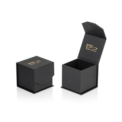 Black jewelry box with gold Daniel Steiger logo, designed for presenting the Malaga Golden Ring, featuring a hinged lid and sleek modern style.