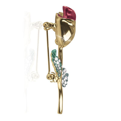 Rosea Brooch featuring a detailed gold-tone flower with a red enamel petal and green leaves accented with small clear crystals, designed for women’s jewelry collections.