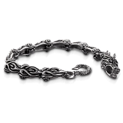 Dragons Lair Steel Bracelet crafted from stainless steel featuring a detailed dragon head clasp and intricate chain design, a bold jewelry piece for men.