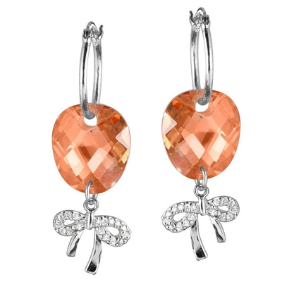 Brandy Bow Earrings featuring sterling silver bows with sparkling accents and faceted peach-colored stones, designed for a stylish female jewelry collection.