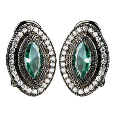 Black Orchid Earrings featuring a sterling silver setting with a central green gemstone surrounded by sparkling clear crystals, designed for women’s elegant jewelry collections.