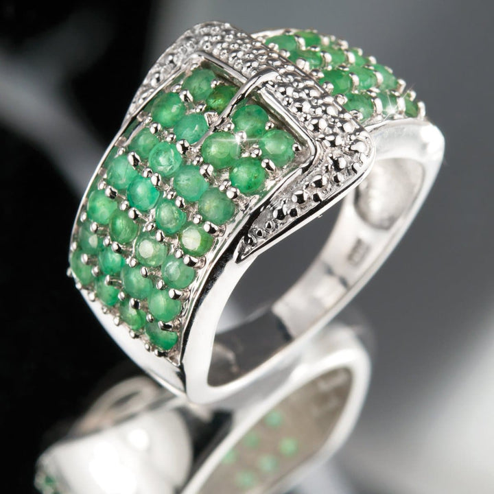 Emerald Buckle Ring crafted in sterling silver with rhodium plating, featuring a buckle design adorned with vibrant green emerald gemstones for a refined female jewelry piece.