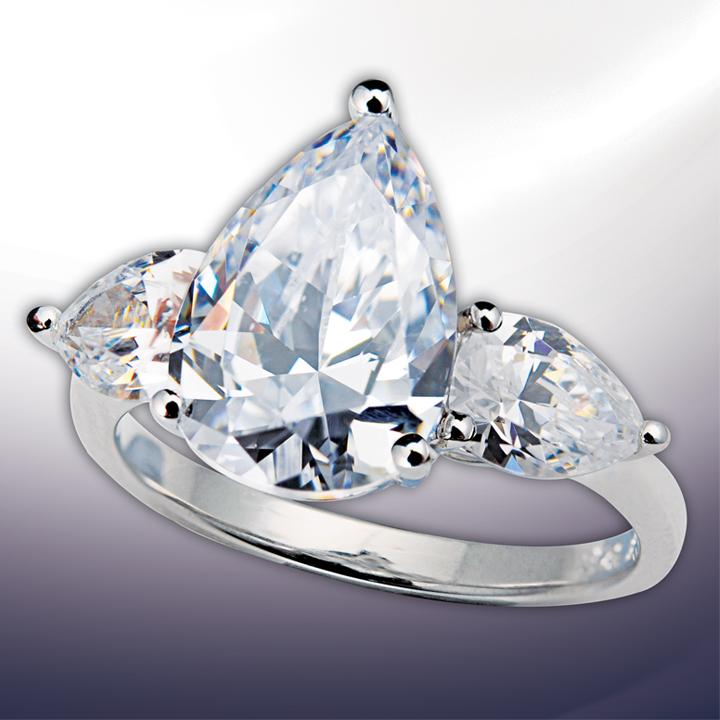 Sterling silver Pear Drop Ring featuring a large pear-shaped clear gemstone flanked by two smaller matching stones, designed for women with elegant, sparkling jewelry style.