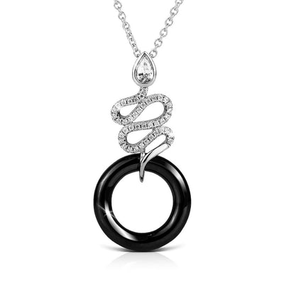 Ceramica Serpent Pendant featuring a sterling silver serpent design with rhodium plating, set above a polished black circular ceramic ring, elegant jewelry for women.