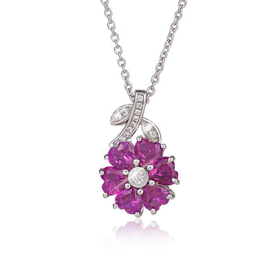 Charlotte Pendant featuring a sterling silver and rhodium-plated floral design with vibrant purple gemstones and sparkling clear accents, elegant jewelry for women.