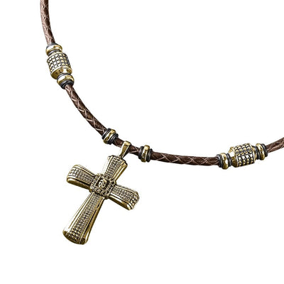 Midnight Skull Gold Fused Pendant featuring a gold-plated sterling silver cross pendant on a brown leather necklace with decorative gold and silver accents, designed for men.