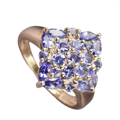 Marquise Tanzanite Ring featuring multiple marquise and round cut tanzanite gemstones set in sterling silver with gold plating, designed for women’s jewelry.