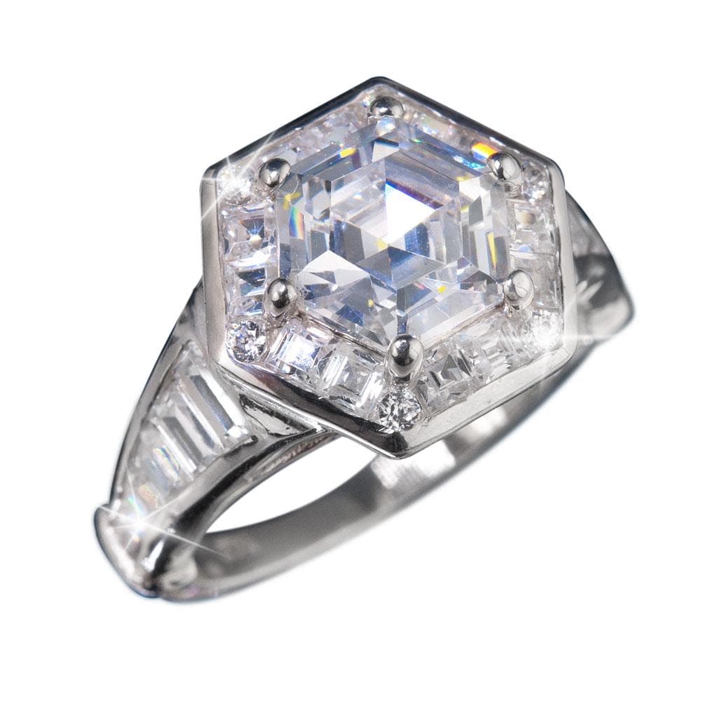 Close-up of the Adelphi Ring, a sterling silver female ring with rhodium plating, featuring a hexagonal clear gemstone surrounded by smaller stones, showcasing intricate craftsmanship and sparkle.