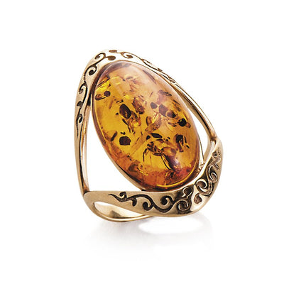Baltic Amber Ring featuring a large polished amber stone set in sterling silver with gold plating, designed for female jewelry lovers seeking elegant rings.