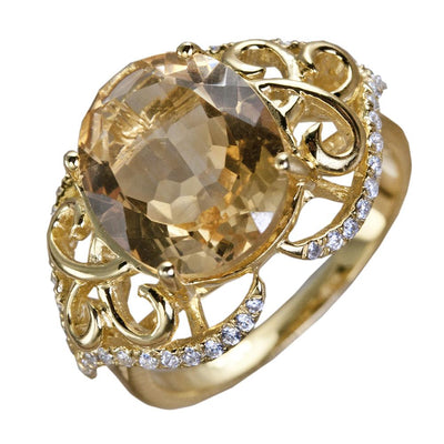 Citrine Solero Ring featuring a large oval citrine gemstone set in sterling silver with gold plating, detailed with intricate scrollwork and small sparkling accents, designed for women.
