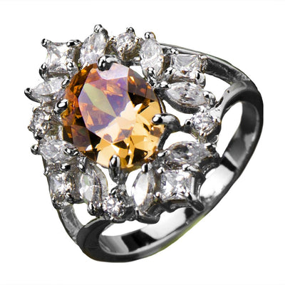 Champagne Spray Ring featuring a central champagne-colored gemstone surrounded by multiple clear stones, crafted in sterling silver with rhodium plating for women’s jewelry.