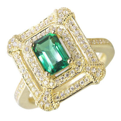 Taylor Ring designed for female, featuring a sterling silver band with gold plating, showcasing a vibrant green gemstone surrounded by sparkling clear stones in an intricate setting.