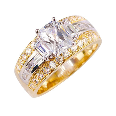 Iona Baguette Ring featuring a two-tone sterling silver band with a large rectangular clear center stone and smaller baguette and round stones for a luxurious jewelry design.