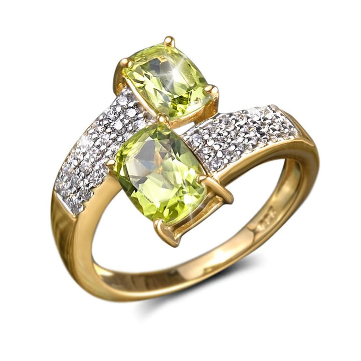 Peridot Hug Ring featuring two vibrant green peridot stones set in sterling silver with gold plating, accented by sparkling clear crystals, designed for women’s jewelry.