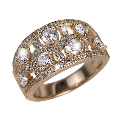 Fountain Ring featuring sterling silver material with gold plating, designed for female wearers, adorned with multiple sparkling clear gemstones in an intricate, elegant pattern.