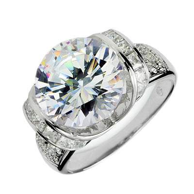 Ultima Ring featuring a large round center stone with smaller stones set in a sterling silver band plated in rhodium, designed for women’s fine jewelry.