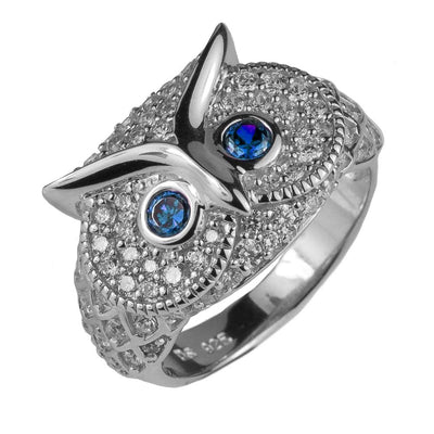 Owl Rhodium Ring featuring a sterling silver band with detailed owl design, adorned with blue gemstone eyes and rhodium plating for a polished finish.