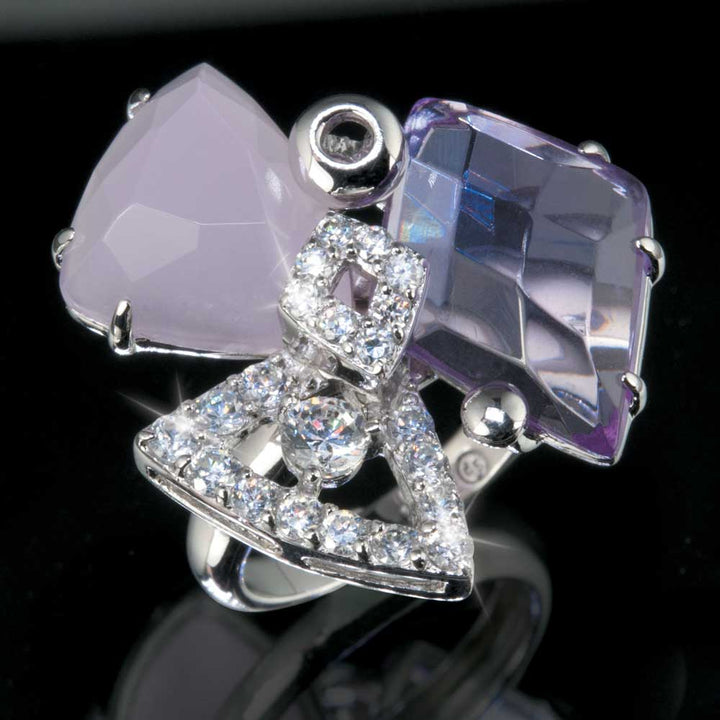 Close-up of a Pink Modernista Ring featuring pink and purple faceted stones with sparkling clear crystals set in silver-tone metal, designed for women’s jewelry collections.