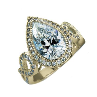 Marie Anna Teardrop Gold Ring featuring a pear-shaped clear gemstone set in sterling silver with gold plating, designed for women’s jewelry.