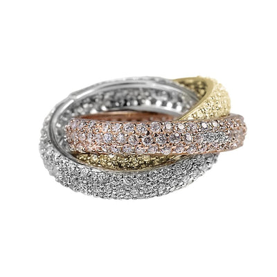 Trilogy Ring composed of three interlocking bands in sterling silver with three-tone plating, embellished with sparkling stones for a refined female jewelry statement.