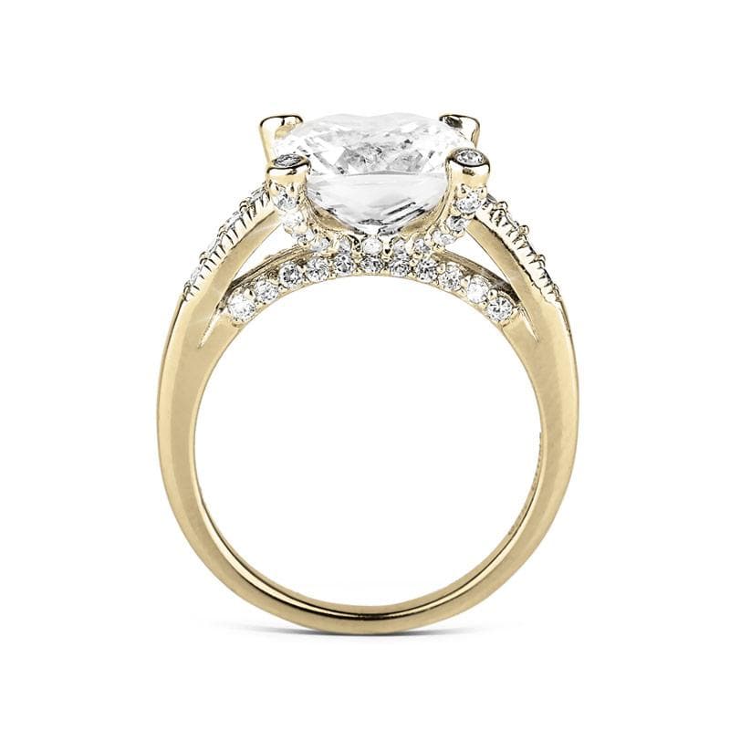 Fiji Golden Princess Ring featuring a sterling silver band plated in gold, designed for females, adorned with a large clear gemstone and smaller accent stones for added sparkle.