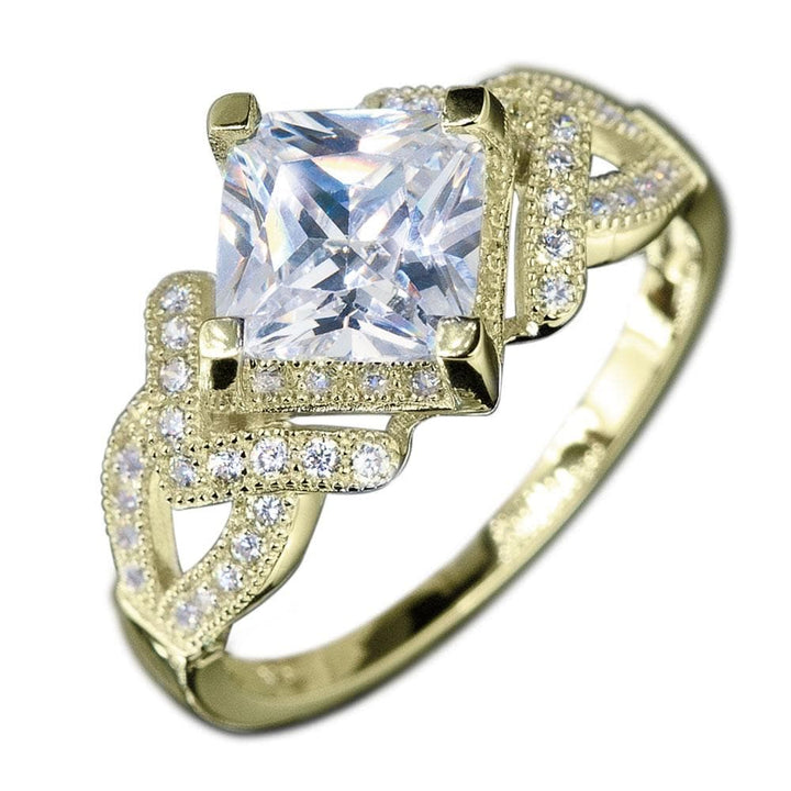 Palermo Gold Ring featuring a square-cut clear gemstone set in a sterling silver band plated with gold, adorned with intricate sparkling accents for women’s jewelry.