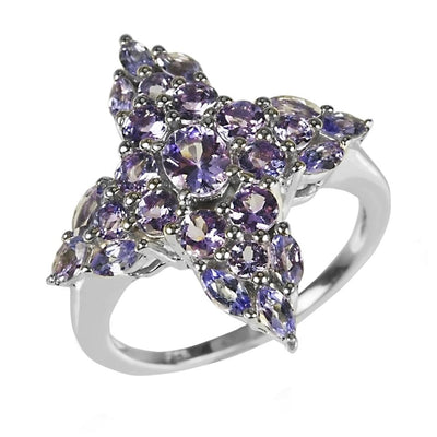 Tanzanite Cross Ring featuring a sterling silver band with rhodium plating, adorned with multiple violet tanzanite gemstones arranged in a cross shape, designed for women’s jewelry.
