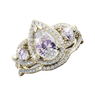 Louis Duo Ring for female crafted in sterling silver with gold plating, featuring a pear-shaped center stone and two round side stones surrounded by sparkling accents.