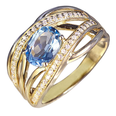 Ophelia Topaz Ring featuring a sterling silver band plated in gold, adorned with a large oval topaz gemstone surrounded by sparkling accent stones for elegant women's jewelry.